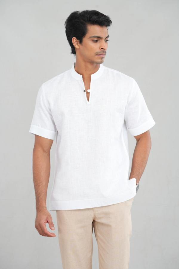 A model wearing a Classic Crisp White shirt made of lightweight linen, perfect for casual summer outings or versatile everyday styling.