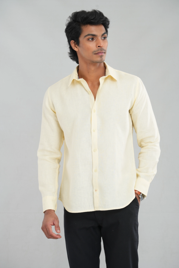 A model wearing a Lemon Pastel Linen shirt with long sleeves and a classic button-up design, perfect for casual summer wear or elegant everyday styling.