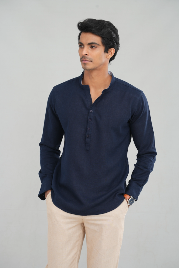 A model wearing a midnight navy linen kurta shirt with long sleeves and a buttoned placket, perfect for casual ethnic wear or stylish everyday outfits.