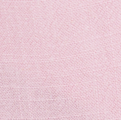 Cotton blend soft pink tailored pants featuring a wide-leg design, functional side pockets, and a secure button closure, ideal for effortless style and comfort in various settings.