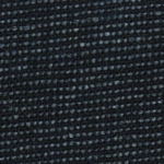 Man wearing charcoal black casual linen shorts with red stitching detail. by tropic of linen