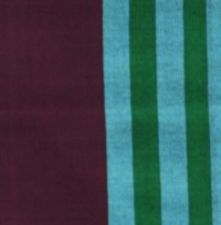 Handloom cotton sarong in deep burgundy with a vertical panel of vibrant aqua and green stripes, hanging on a rack.