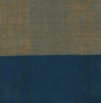 Handloom cotton sarong in muted khaki with wide navy blue and sky blue horizontal stripes at the hem, hanging on a rack.