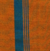 Rich mustard-colored handloom cotton sarong with a single vertical teal stripe, hanging on a rack.