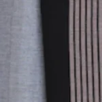 Man wearing a light grey handloom cotton sarong with a wide black vertical panel featuring fine pink pinstripes.