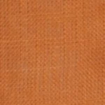 Man wearing a terracotta brown long sleeve linen shirt with a navy contrast inner collar, styled open over a white t-shirt and jeans. Man smiling while wearing a terracotta brown long sleeve shirt featuring a navy blue contrast collar.