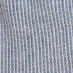 Young girl wearing blue and white pinstripe linen cargo jogger pants with a drawstring waist and side cargo pockets.