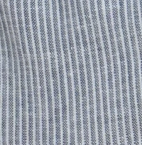 Young girl wearing blue and white pinstripe linen cargo jogger pants with a drawstring waist and side cargo pockets.