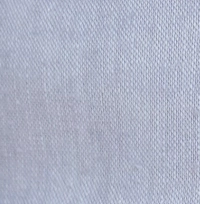 Young girl wearing a chambray blue linen button-front cami dress with adjustable straps.