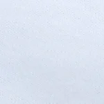 Woman wearing a classic white cotton cropped t-shirt with a subtle tonal embroidered logo on the chest, paired with high-waisted trousers, tonal white embroidered logo on a classic white crop tee.