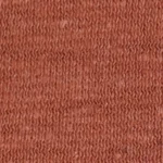 Woman wearing a heathered terracotta orange cotton jersey raw edge cropped t-shirt with a tonal embroidered logo.