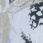 Woman wearing a light blue and grey botanical print cotton Mandarin collar halter top, paired with black shorts.