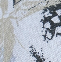 Woman wearing a light blue and grey botanical print cotton Mandarin collar halter top, paired with black shorts.