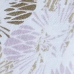 Woman wearing a white and lilac abstract floral print cotton Mandarin collar halter top, paired with white shorts.