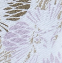 Woman wearing a white and lilac abstract floral print cotton Mandarin collar halter top, paired with white shorts.