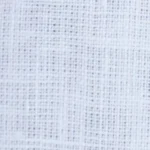 Woman wearing a classic white linen Mandarin collar halter top with a full button-front, paired with white trousers, the Mandarin collar and button placket detail on a white linen halter top.