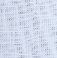 Woman wearing a classic white linen Mandarin collar halter top with a full button-front, paired with white trousers, the Mandarin collar and button placket detail on a white linen halter top.