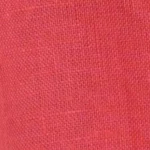 Woman wearing a knee-length coral pink linen button-front cami dress with adjustable straps and side pockets.