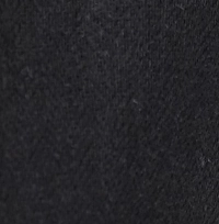 Woman wearing a charcoal brown linen-cotton blend shawl collar tunic with an empire waist and three-quarter sleeves.