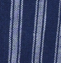 Woman wearing an indigo blue and white striped linen-cotton blend cami romper with side pockets.