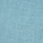 Woman wearing light turquoise linen-cotton blend wide-leg culottes with a high side slit, showcasing movement, the elegant high side slit detail on light turquoise wide-leg cropped pants.