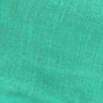 Woman wearing a spearmint green linen button-back sleeveless crop top as part of a matching set.