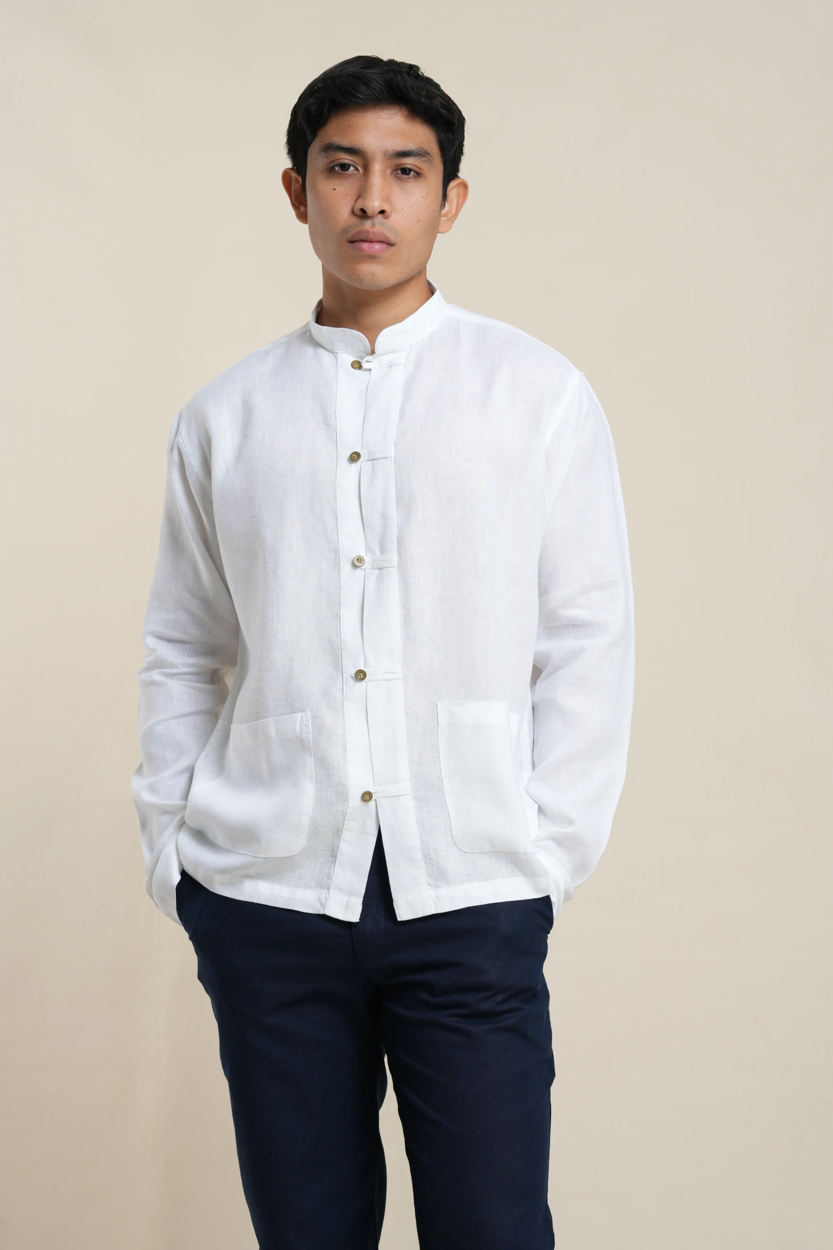 Men's linen chore jacket in White, front-facing view with coconut shell buttons — Tropic of Linen WH0087