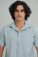 Men's short sleeve shirt in peachy beige front-facing styled view — Tropic of Linen BE0049