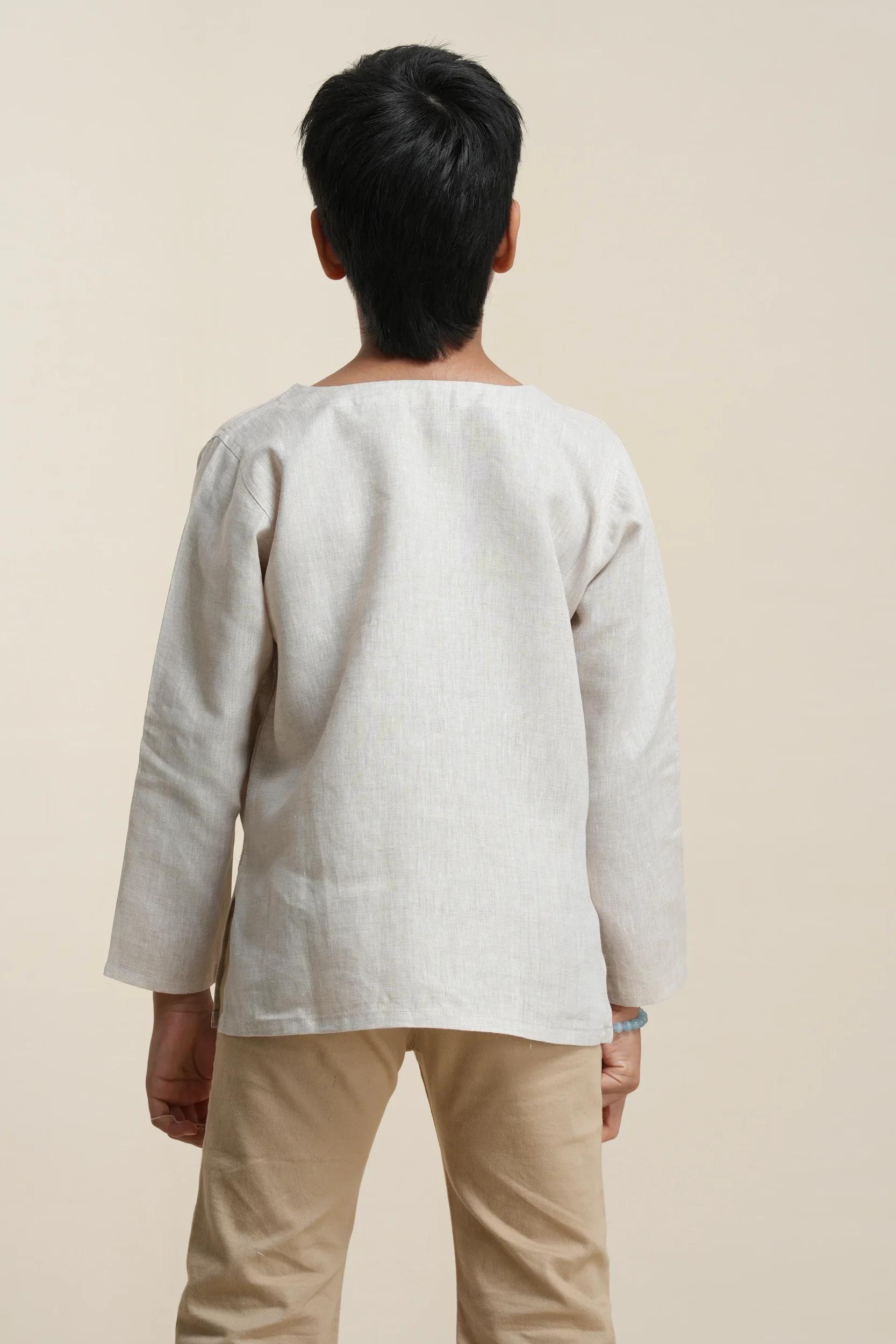 Boys' linen kurta in Oatmeal, back view showing relaxed fit — Tropic of Linen BE0059
