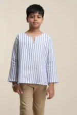 Young boy wearing blue and white striped linen kurta with long sleeves, v-notch neckline, paired with beige trousers