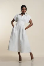 Women's collared midi dress in beige linen, front view showing V-neckline and pleated skirt — Tropic of Linen BE0060