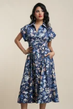 Navy floral print collared midi dress in cotton blend, front view on model with fitted waist and full skirt