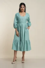 Women's tiered midi dress in Seafoam Green linen, front view — Tropic of Linen GRN081