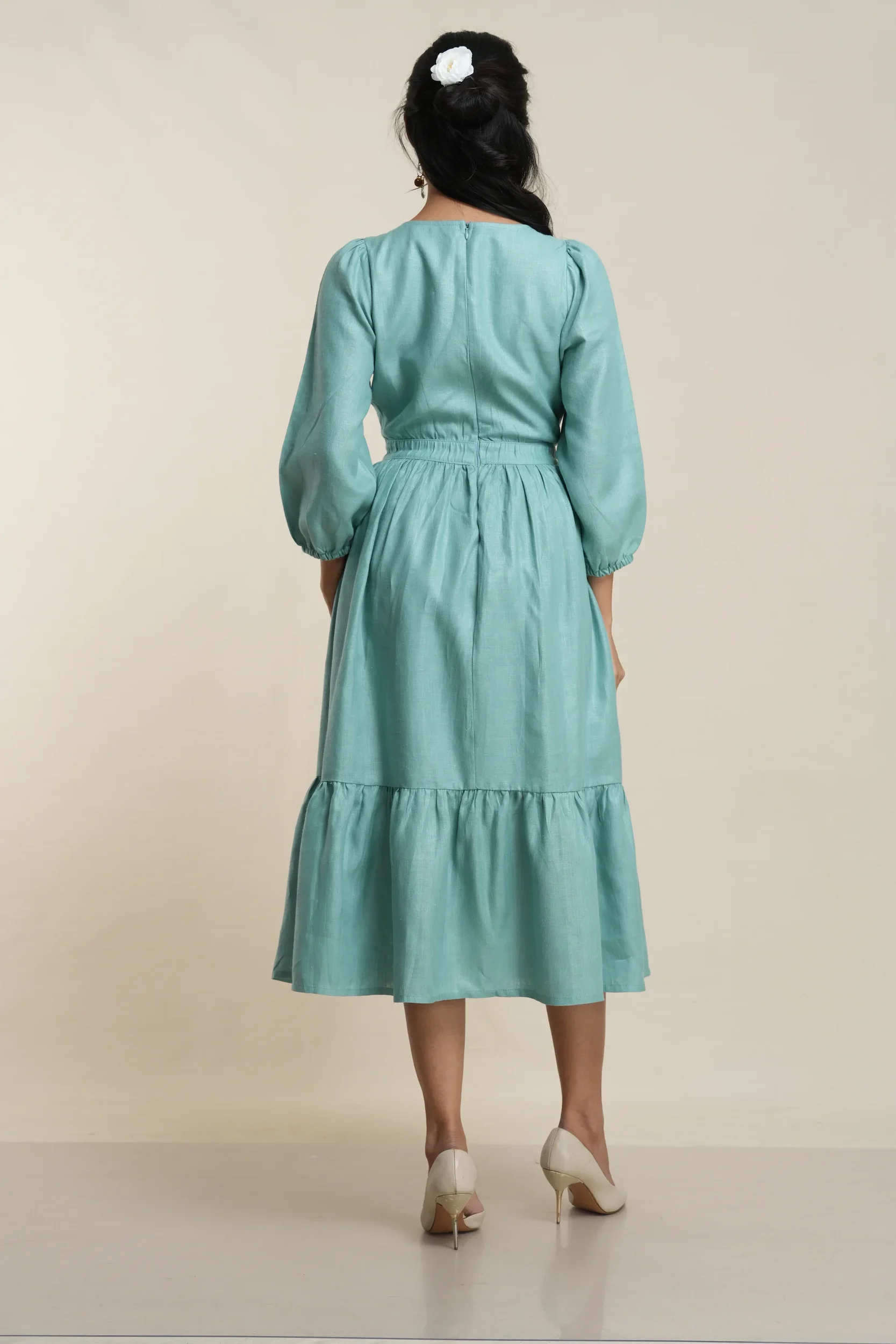 Women's tiered midi dress in Seafoam Green linen, back view showing zip closure — Tropic of Linen GRN081