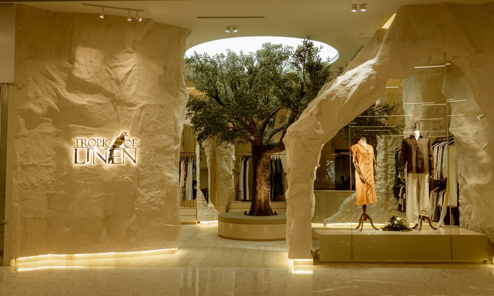 Tropic of Linen store front at The Shoppes, City of Dreams Colombo, with the olive tree under the skylight